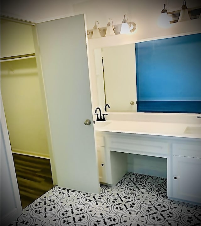 bathroom with tile patterned floors and vanity