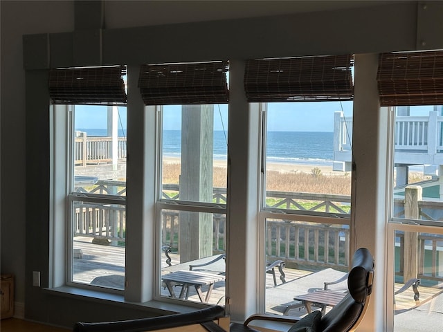 entryway featuring a water view and a beach view