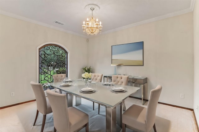 carpeted dining area with ornamental molding and a chandelier