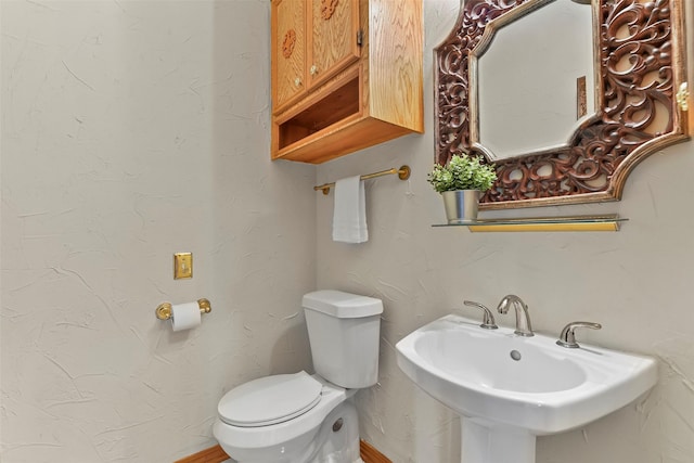 bathroom with sink and toilet