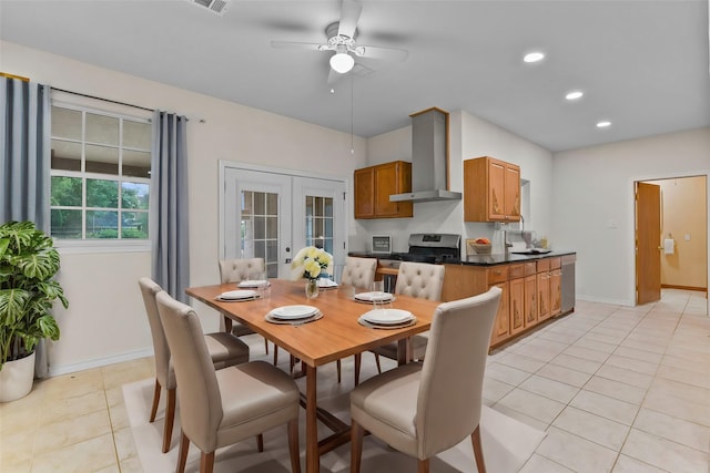 dining area featuring light tile patterned floors, ceiling fan, and french doors