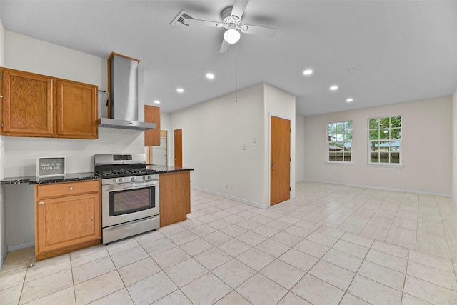 kitchen with light tile patterned floors, ventilation hood, stainless steel range with gas stovetop, and ceiling fan