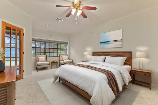 carpeted bedroom featuring ornamental molding and ceiling fan