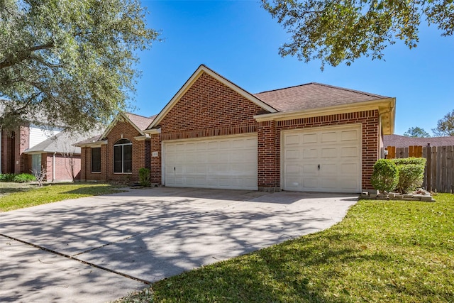 ranch-style home featuring an attached garage, fence, and brick siding