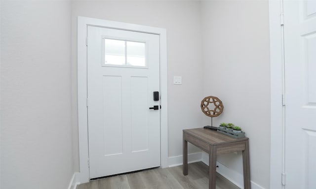 entryway with light hardwood / wood-style floors