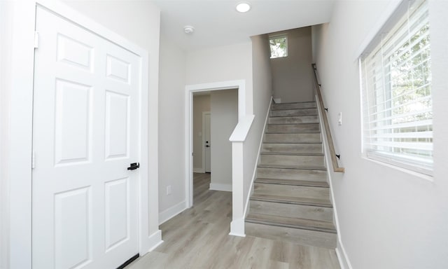 stairs with wood-type flooring