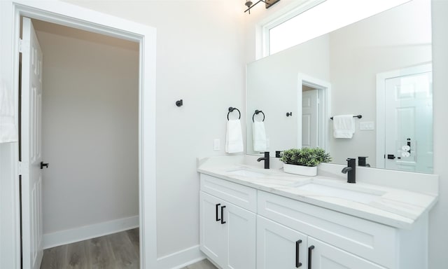 bathroom featuring vanity and hardwood / wood-style flooring