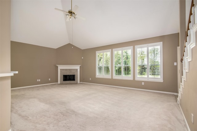 unfurnished living room featuring high vaulted ceiling, a fireplace, light colored carpet, and ceiling fan