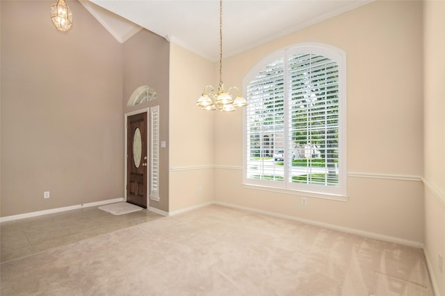 carpeted empty room featuring an inviting chandelier and ornamental molding