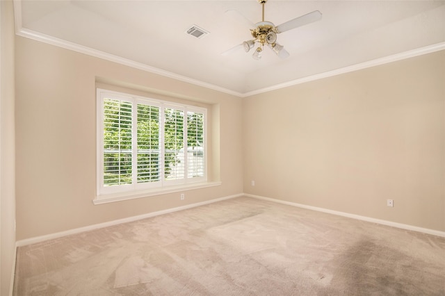 carpeted empty room with crown molding and ceiling fan