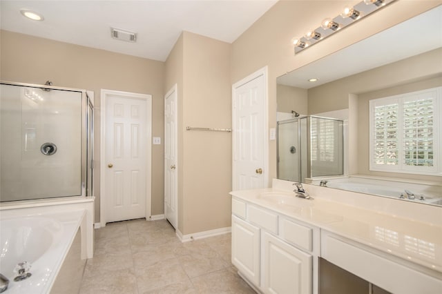 bathroom featuring vanity, tile patterned flooring, and shower with separate bathtub