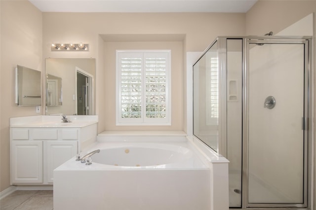 bathroom featuring tile patterned flooring, shower with separate bathtub, and vanity