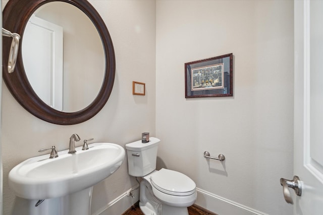 bathroom with toilet and sink