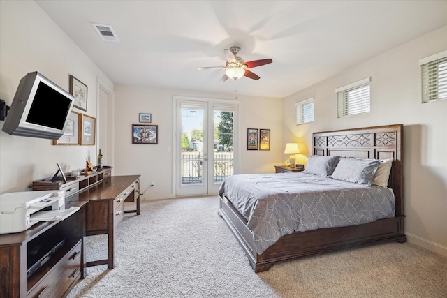 carpeted bedroom with ceiling fan and access to outside