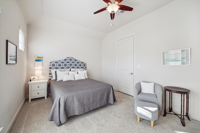 carpeted bedroom featuring lofted ceiling and ceiling fan