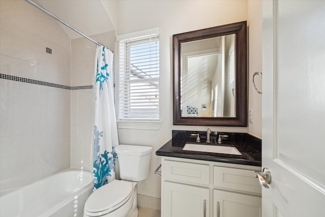 full bathroom with vanity, shower / bath combo, and toilet