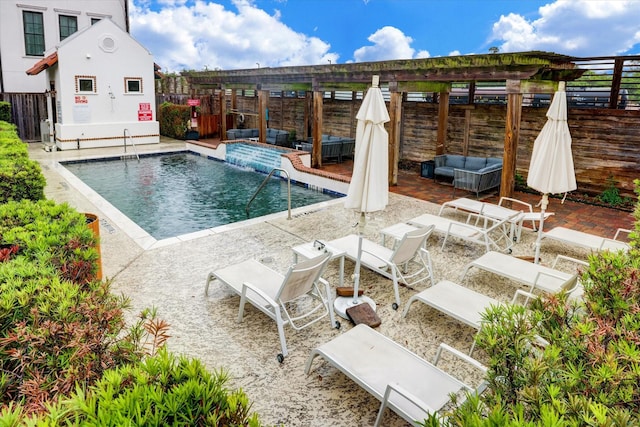 view of pool featuring outdoor lounge area, a patio, and pool water feature