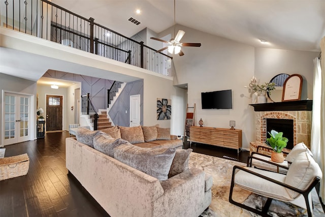 living room featuring ceiling fan, high vaulted ceiling, and dark hardwood / wood-style flooring