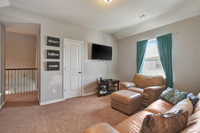 carpeted living room featuring lofted ceiling