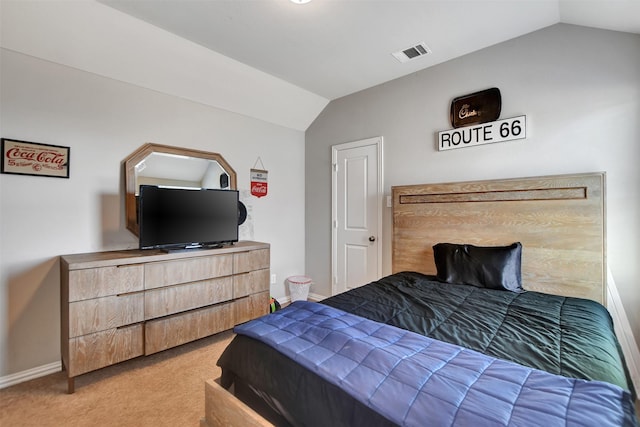 carpeted bedroom featuring vaulted ceiling