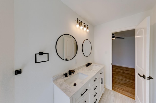 bathroom featuring vanity and hardwood / wood-style flooring