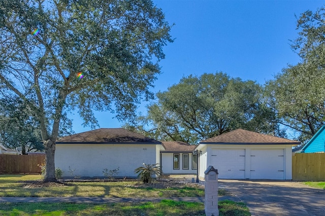 ranch-style home featuring a garage