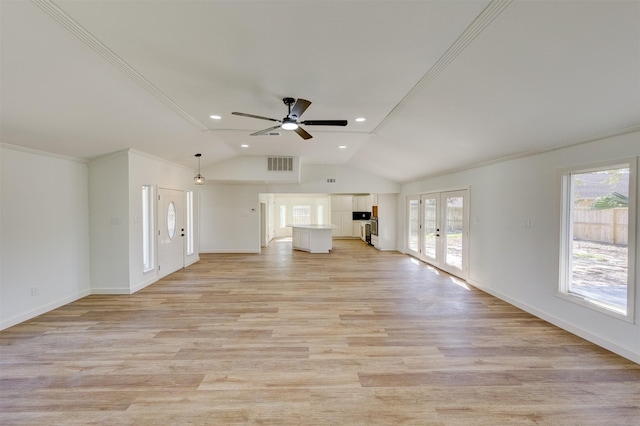 unfurnished living room featuring french doors, lofted ceiling, light wood-type flooring, and plenty of natural light