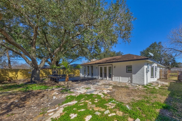 rear view of property with a patio and french doors