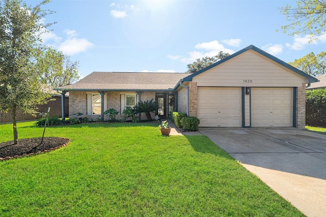 ranch-style home featuring a garage and a front lawn