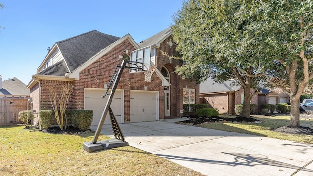 view of front of house featuring a garage and a front lawn