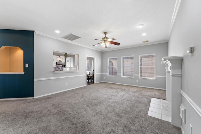 unfurnished living room featuring ornamental molding, ceiling fan, and carpet