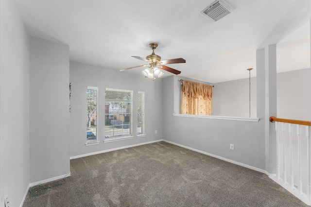 carpeted empty room with ceiling fan