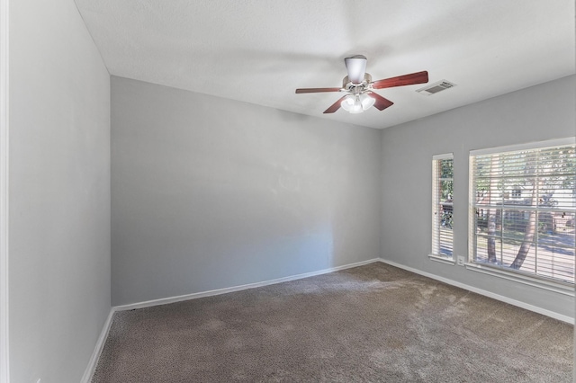 spare room featuring carpet floors and ceiling fan