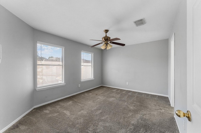 carpeted empty room featuring ceiling fan