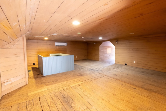 bonus room featuring wooden walls, wooden ceiling, and light wood-type flooring