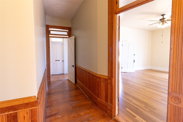 corridor with wood-type flooring