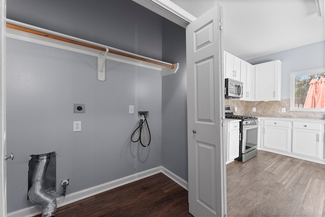 laundry area featuring wood-type flooring and electric dryer hookup