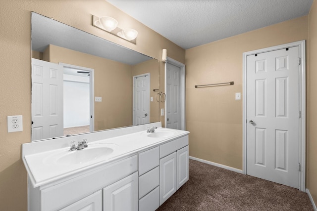 bathroom featuring vanity and a textured ceiling