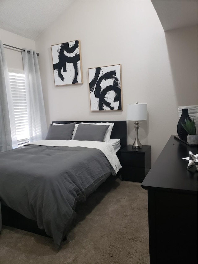 carpeted bedroom featuring vaulted ceiling