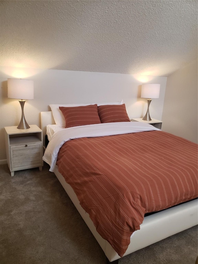 carpeted bedroom with a textured ceiling