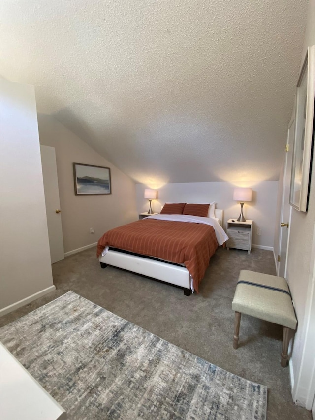 bedroom with lofted ceiling, carpet flooring, and a textured ceiling