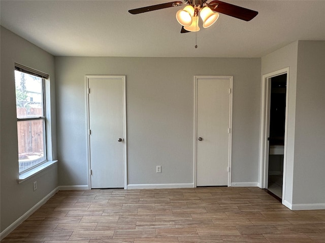 unfurnished bedroom with ceiling fan and light hardwood / wood-style flooring