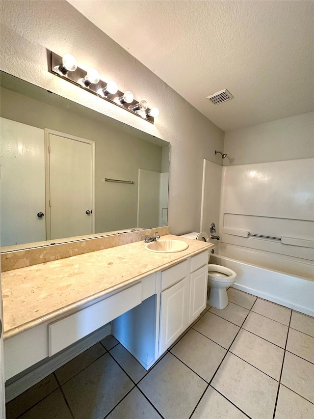 full bathroom with toilet, tub / shower combination, a textured ceiling, vanity, and tile patterned flooring