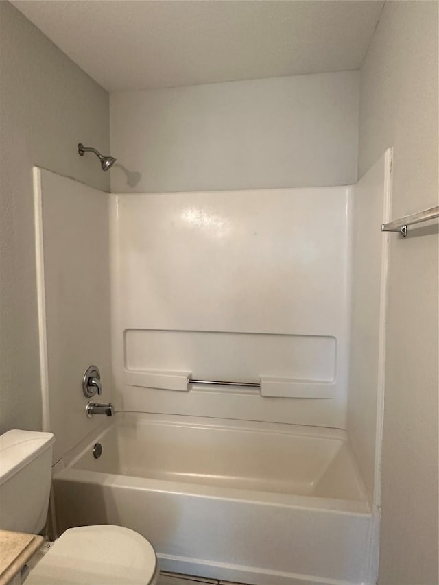 full bathroom featuring vanity, bathtub / shower combination, and toilet