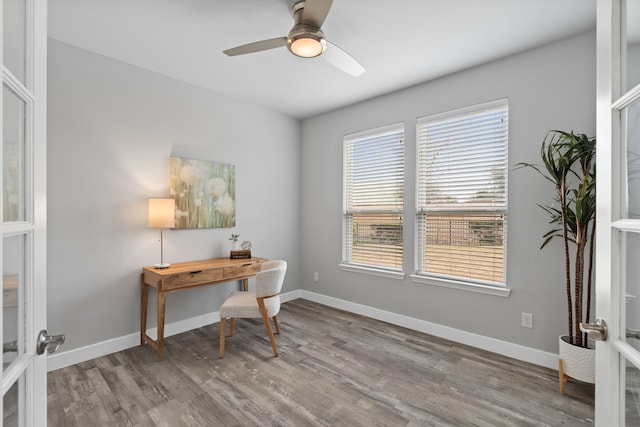 office with french doors, ceiling fan, and light hardwood / wood-style floors