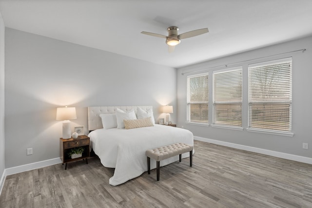 bedroom with ceiling fan and light wood-type flooring