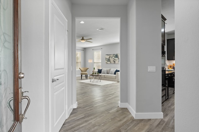 entryway featuring hardwood / wood-style floors and ceiling fan