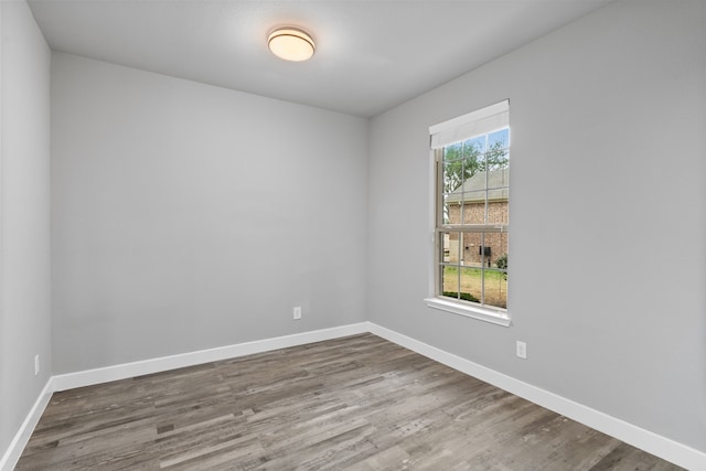 spare room with hardwood / wood-style flooring