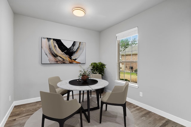 dining area featuring dark hardwood / wood-style floors