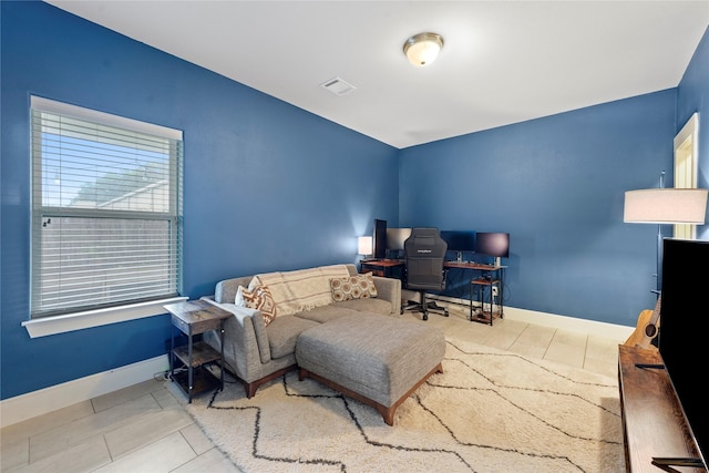 bedroom featuring tile patterned flooring, visible vents, and baseboards